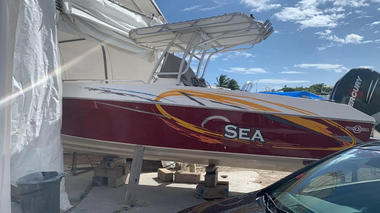 Centre console with restored graphics and glossy red hull by SXM Refinishing in St. Maarten