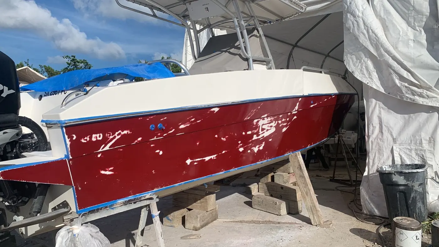 Finished deep red hull with high-gloss topcoat by SXM Refinishing in St. Maarten