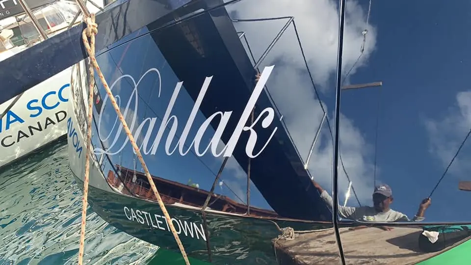 Mirror-gloss transom with hand-applied Dahlak lettering by SXM Refinishing in St. Maarten